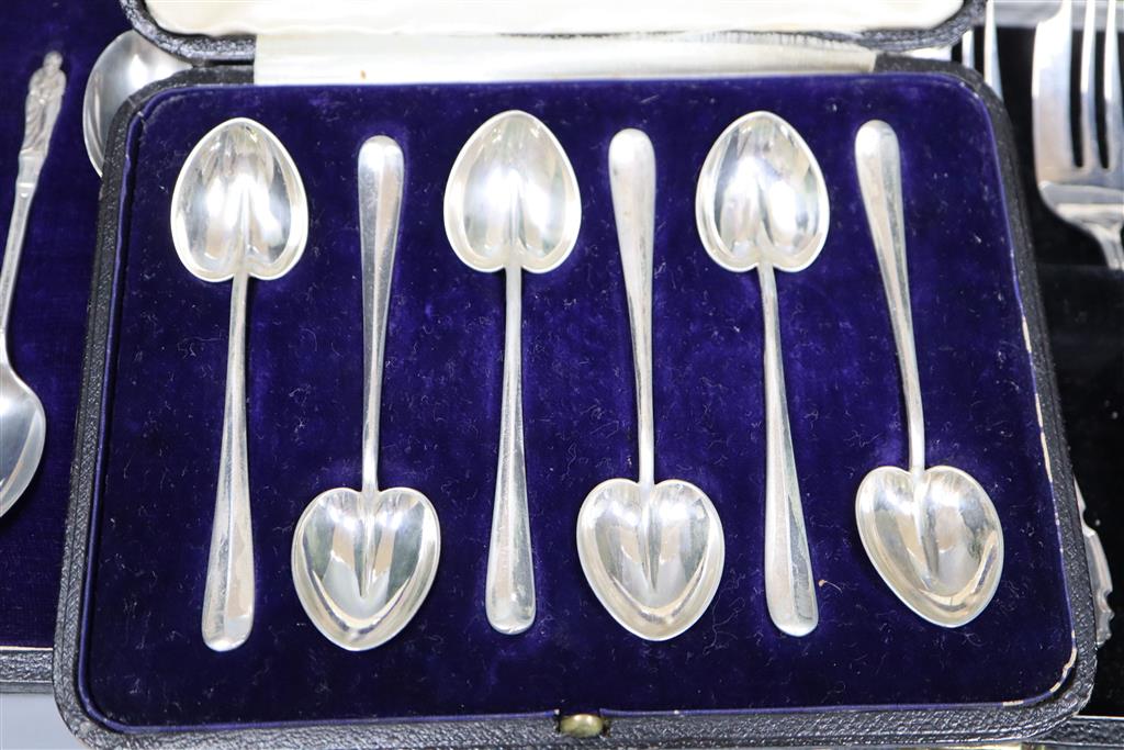 Six silver cake forks, six silver coffee spoons and six silver apostle teaspoons (all cased) and six pairs of dessert eaters